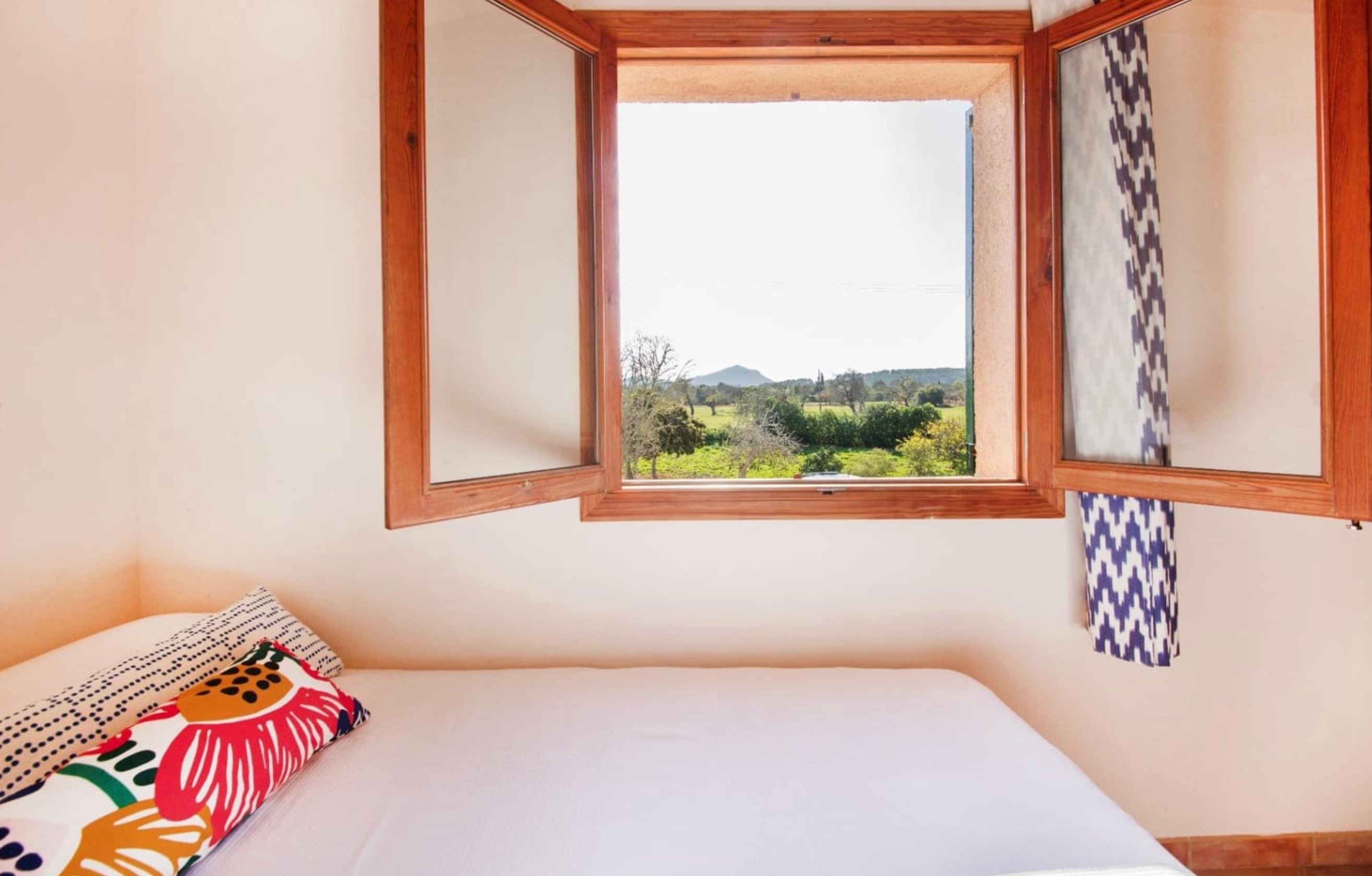 Single bedroom with scenic countryside window view